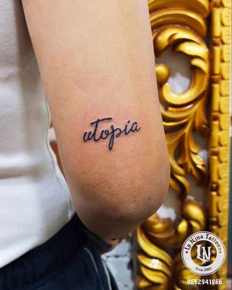 Utopia : the perfect place. Done at La nina Tattoo Studio #ahmedabad  #gujarati  #India #tattoo #tattooideas #tattooart #tattoodesigns #tattoosforwomen #calligraphy #ink #tattooahmedabad Utopia Tattoo, Nina Tattoo, India Tattoo, Tattoo Calligraphy, Script Tattoo, Calligraphy Tattoo, Calligraphy Ink, Tattoo Script, Name Tattoos