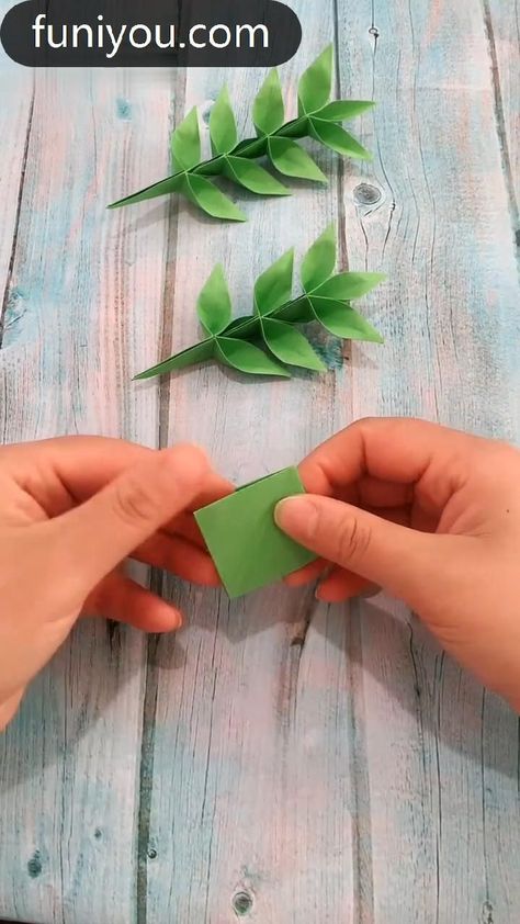 Origami's precise designs and geometric patterns add sophistication to any space. Flower Origami Aesthetic, Christmas Decor Ideas Origami, Origami Vines, Origami Flowers Aesthetic, How To Make Paper Vines, Leaf Origami Paper Leaves, Origami Flower Stem, Origami Plants Tutorial, Paper Oragami Ideas