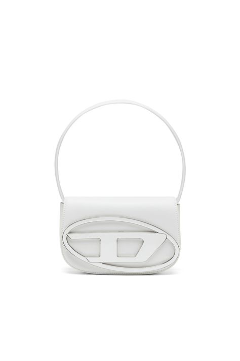 This small structured bag is crafted from nappa leather. It has a handle that fits over the shoulder and an optional belt-like strap for cross-body wear. The flap is embellished with an enamelled metal plaque featuring the new oval 'D' logo.-Top handle;Detachable adjustable shoulder strap;Magnetic flap closure;Main compartment with slip pocket;Front flat compartment Diesel Bag, Leather Shoulder Bag Woman, Leather Supplies, Structured Bag, Fancy Bags, Metal Plaque, Pretty Bags, Cute Bags, Nappa Leather