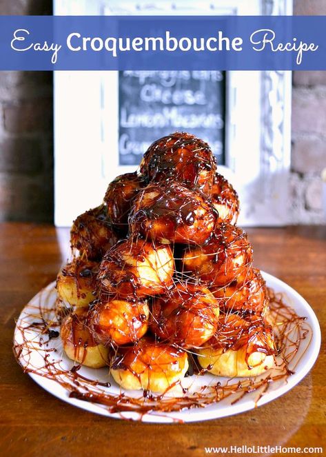Learn how to make an easy Croquembouche! This French Croquembouche recipe is a fun dessert recipe for holidays that families love! Make this pate a choux tower from cream puffs, caramel, and spun sugar … very impressive, but no special tools required. This simple Croquembouche is perfect for weddings, Christmas, or parties of any type! | Hello Little Home #croquembouche #frenchpastry #pastry #pateachoux #creampuffs #caramel #frenchdessert #dessertrecipes #frenchrecipe Croquembouche, Essen, Pie, Mini Croquembouche, Croquembouche Recipe, Birthday Cake Alternatives, Asparagus Tart, Christmas Meals, Cream Puff Recipe