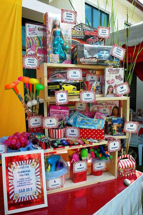 Carnival prizes booth. Lizzie as a Mummy: Ian's 1st Birthday Circus Carnival - DIY Ideas! Carnival Game Booth Diy, Diy Carnival Tickets, Prize Booth Ideas, Prize Table Ideas, Carnival Prizes For Adults, Carnival Birthday Party Prizes, Diy Carnival Prize Booth, Diy Carnival Ticket Booth, Carnival Fundraiser Ideas