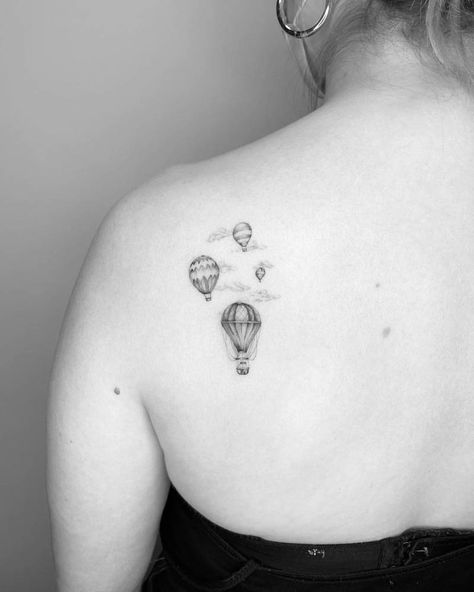 Single needle hot air balloons tattooed on the shoulder Patchwork, Vintage Globe Tattoo, Tiny Hot Air Balloon Tattoo, Vintage Hot Air Balloon Tattoo, Airbaloon Tattoo, Hot Air Balloon Tattoos, Hot Air Balloon Tattoo Vintage, Small Hot Air Balloon Tattoo, Hot Air Balloon Tattoo Small