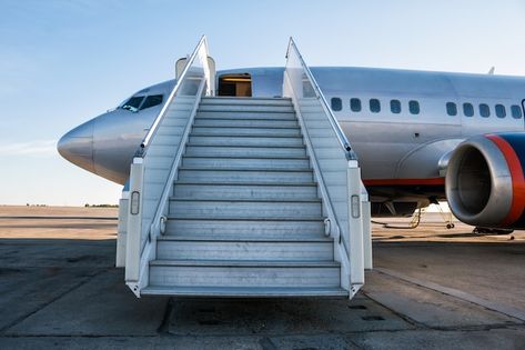 Passenger aircraft with a boarding ramp ... | Premium Photo #Freepik #photo #airplane-aircraft #aircraft #jet-plane #aviation Apron, Aircraft