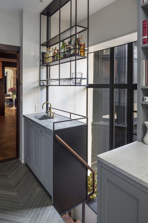 A mini bar in the dining room cabinet with open shelves in front of window above for liquor bottles and glasses. park-slope-bar-sink-remodelista Narrow Kitchen Design, Suspended Shelves, Modern Home Bar, Upper Kitchen Cabinets, Home Bar Design, Narrow Kitchen, Farmhouse Kitchen Cabinets, Industrial Interior, Kitchen Shelves