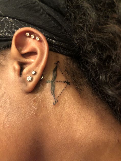 Sagittarius tattoo behind ear Patchwork, Sagittarius Behind The Ear Tattoo, Ankh Behind Ear Tattoo, Sagittarius Neck Tattoo, Sagittarius Tattoo Behind Ear, Zodiac Sign Tattoos Sagittarius, Tattoo Ideas Female Sagittarius, Sag Tattoo, Tattoos Sagittarius