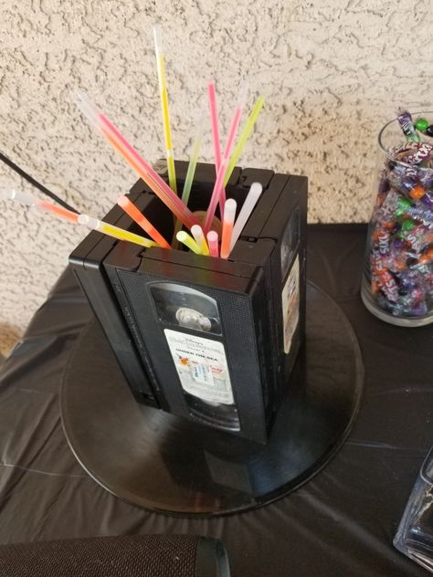 90s Birthday Party Theme Centerpieces, Diy 80s Backdrop, 80s Dinner Party Table Settings, 80s Outdoor Party, 80s Birthday Centerpieces, 1983 Party Ideas, 80s Theme Party Favors, Decades Party Centerpieces, 80s Themed Food Party Ideas