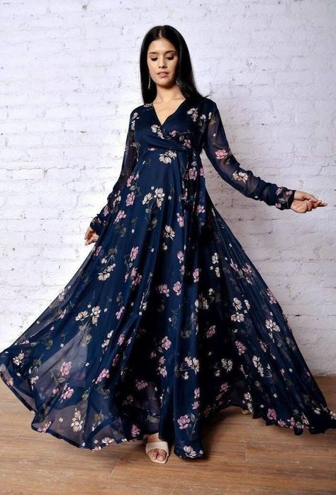"**RooRichWear Presenting Designer Dark Blue Printed Gown** GOWN ----------------------- Fabric. :- Fox Georgette Work :- Flower Printed Work Sleeve :- 20\" Inch Flare :- 3.5 \"Umbrella flare Size :- M(38) L(40) XL(42) XXL(44) Height :- 52+ Inch Wear :- Dark Blue Knot For an absolutely stunning look, wear this Georgette maxi dress with long sleeve, Its specially designed for comfortableness and Crafted from Georgette. Note : Color may vary due to the photography in the light effect." Crepe Gown Styles, Flower Print Gown, Full Sleeve Long Dress, Dark Blue Gown, Full Sleeve Gowns, Maxi Dress Indian, Frock Models, Full Sleeves Design, Floral Dresses With Sleeves