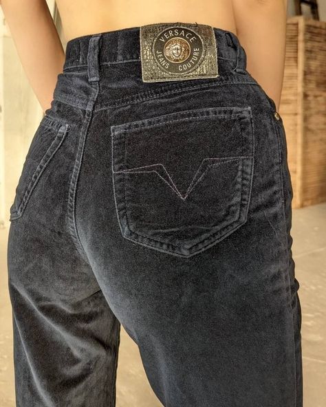 "Vintage navy blue velvet pants from Versace jeans Couture. High-waisted jeans with zipper and button closure at front. Two pockets at front and two on the back. Ankle length. Silver buttons and hardware with medusa head. The length of the jeans is hemmed. Condition 9/10 (small stain on the back of the leg) Size 27/41 Made in Italy 100% cotton Length- 37-38\"/95+3 cm In-Seam- 27\"/68.5 cm Waist- 12\"/30 cm Hips- 16\"/41 cm All measurements taken with garment lying flat.  Vintage sizes vary great Couture, Velvet Jeans Outfit, Blue Velvet Pants, Navy Blue Trousers, 90s Versace, Aw 23, Versace Jacket, Vintage Red Dress, Velvet Jeans