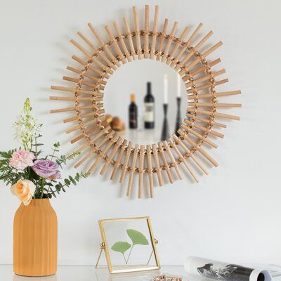Add a boho touch and beautiful decor to your home with this hanging wall mirror. It is composed of durable handwoven rattan material with a sun design that will add a bohemian look to your home. Its neutral color allows it to complement and blend in with any home design theme. Ideal to hang it on the wall in your dining room, entryway, office, living, bedroom, or bathroom. Features an attached hook on the back of the mirror that makes hanging easy and convenient.? Decorate your home and office w Bathroom Boho, Rattan Wood, Boho Mirror, Rattan Material, Dining Room Entryway, Entryway Office, Girly Apartment Decor, Boho Bathroom Decor, Living Bedroom