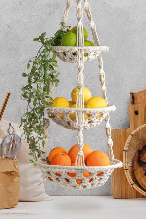 Modern Boho Decor: This macrame fruit basket is the perfect boho addition to your kitchen. It will nicely display your fruit, veggie, produce or anything else you store in this macrame hanging basket. It's very sturdy and can hold up to 15 pounds! 3 Tier Macrame Fruit Basket, Fruit Hanging Basket Ideas, Hanging Fruit Baskets Kitchen, Kitchen Fruit Hanging Basket, Kitchen Veggie Basket, Hanging Veggie Basket, Macrame 3 Tier Hanging Basket, Diy Fruit Hanging Basket, Boho Fruit Basket