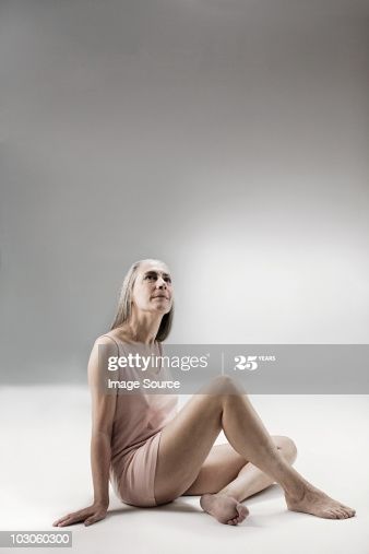 Senior Woman Sitting On Floor High-Res Stock Photo - Getty Images Croquis, Woman Sitting Reference, Person Sitting On Floor Reference, Sitting Pose Reference Floor, Sitting On The Floor Pose, Sitting On Floor Pose, Woman Sitting On Floor, Ghost Project, Sitting Pose Reference