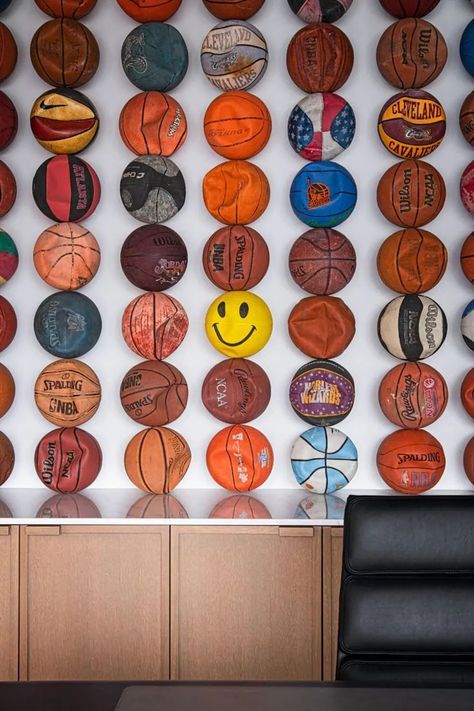 12 Modern Teen Boy Bedroom Ideas That He'll Love Deflated Basketball Art, Guatape, Basketball Coach Office Ideas, Man Cave Basketball, Deflated Basketball Wall, Basketball Man Cave Ideas, Basketball Inspired Room, Basketball Installation Art, Sports Game Room Ideas