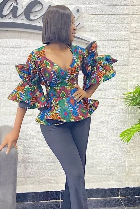 17 Stylish Fancy Ankara Tops. - Gist94 Ankara Peplum Top Outfits Casual, Ankara Top On Jeans Trouser, Ankara Blouse And Trouser For Women, Top For Ankara, Ankara Tops And Trousers For Ladies, Ankara Trouser And Top For Ladies, Ankara Top And Trousers For Ladies, Ankara Tops For Trousers, African Trousers And Top For Women