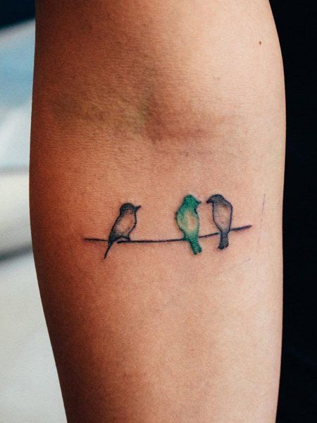 Three Little Birds Tattoo Small Tattoos Birds Simple, Bird Tattoo Matching, Flock Of Birds Tattoo Arm, Tattoos In Threes, Simple Small Bird Tattoo, Three Part Tattoos, Bird Name Tattoo, Wrist Bird Tattoos For Women, Tiny Bird Tattoos For Women Wrist