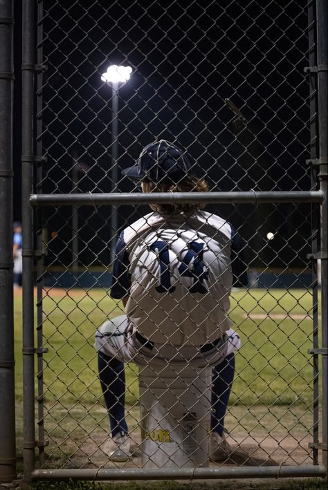 This photo contains a high school male sitting on an upside down bucket at night on the baseball field with only the stage lights on. The photo shows his uniform number which is #14. High School Baseball Aesthetic, Baseball Astethic, Highschool Baseball, Simp Pics, Baseball Aesthetic, 80s Sports, Akanishi Jin, Baseball Accessories, Baseball Photography