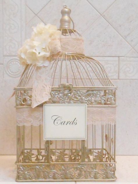 Your vintage theme calls for delicate flowers and pastel colors. Bird cages have been a popular option for card boxes and all you need to do is glam it up with ribbons or flowers of your choice. - See more at: http://www.quinceanera.com/decorations-themes/card-box-ideas-quinceaneras/?utm_source=pinterest&utm_medium=social&utm_campaign=decorations-themes-card-box-ideas-quinceaneras#sthash.hXNVUwEm.dpuf Card Box Ideas, Birdcage Wedding, Wedding Birdcage, Quinceanera Decorations, Wedding Card Holder, Quinceanera Party, 50th Wedding Anniversary, Card Box Wedding, 50th Wedding
