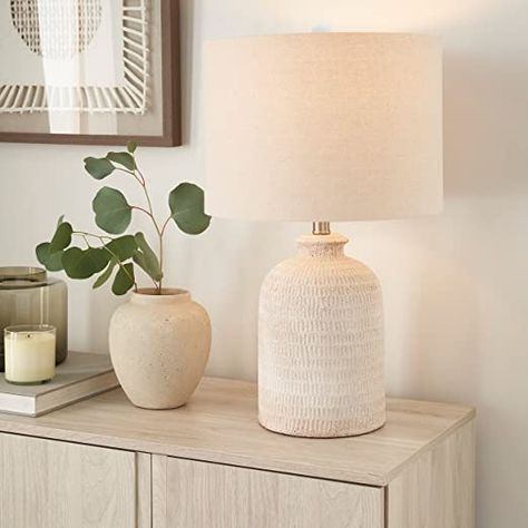 Nourison 24" White Washed Terracotta Farmhouse Textured Table Lamp bout this item Textured coastal farmhouse table lamp Product Dimensions: 13" x 13" x 24" BULB NOT INCLUDED: requires standrd E26 bulb max 100W, LED compatible. Minimal assembly required: must attach finial, harp and shade. Dust or wipe with a soft dry cloth, do not use any abrasive cleaners Terracotta Farmhouse, Coastal Farmhouse Table, Bed Side Table Lamps, Farmhouse Table Lamp, Neutral Lamps, Natural Table Lamps, Farmhouse Table Lamps, Boho Lamp, Retro Table Lamps