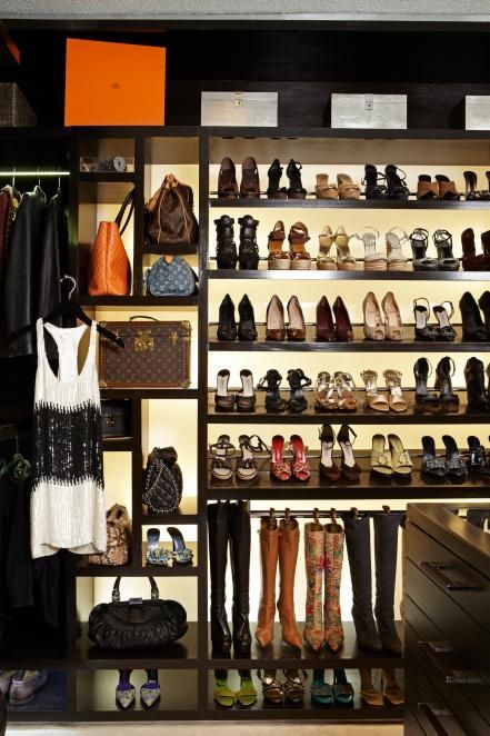 A custom shelving unit is the stand-out feature in this walk-in closet. Stocked with bags and shoes, the backlit shelves show off the sartorial goods while making each item easier to find. Dream Closet Design, Luxury Closets Design, Custom Shelving, Walk In Robe, Closet Decor, Dream Closets, غرفة ملابس, Custom Storage, Hus Inspiration