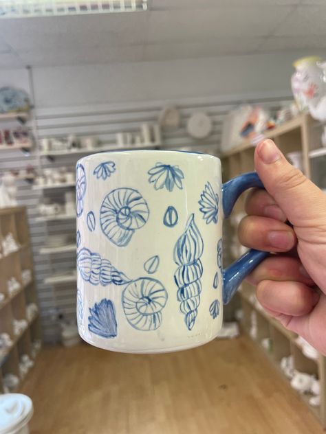 🐚This shell mug was painted by one of our talented customers! ☀️What design would you paint on a mug? #potterypainting #pyop #potterypaintingstudio #paintyourownpottery #stneots #cambs #cambridgeshire #creativeactivities #huntingdonshire #thingstodocambs #creativethingstodo #creativedaysout Cute Tray Painting Ideas, Petroglyph Pottery Ideas, Whale Shark Pottery Painting, Beach Themed Pottery Painting, Shell Pottery Painting, Coastal Mug, Sea Themed Pottery Painting, Seashell Pottery Painting, Painted Tray Ideas