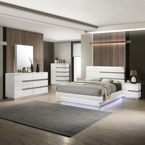 Light and bright in glossy white, this four-piece modern glam bedroom set showcases chic asymmetric design elements and glittering crushed crystal trim that add sparkling personality. Glam Bedroom Set, Lighted Headboard, Modern Glam Bedroom, 5 Piece Bedroom Set, New Classic Furniture, Glam Bedroom, King Platform Bed, Asymmetric Design, King Bedroom Sets