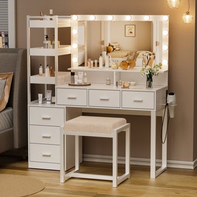 If you are looking for an exquisite best-in-class dressing table for your home, you must not miss this elegant classic dressing table set. This elegant and modern vanity set features a large mirror with three color light modes, a built-in charging station with two USB ports and two outlets, and a hair dryer rack for your convenience. The spacious desktop, six drawers, four cabinets, and three movable shelves provide ample storage space for all your cosmetics, jewelry, and other essentials. The c Cute Dressing Table Ideas, Cute Dressers For Bedroom, Closet And Vanity Room Ideas, Cabinet Ideas Bedroom, Vanity Decor Ideas Bedroom, Vanity For Small Bedroom, Bedroom Sets Ideas, Cute Dressing Table, Bedroom Shelving Ideas