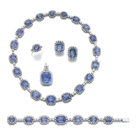 Sapphire and diamond parure Comprising: a necklace, a pendant, a bracelet, a pair of earrings and a ring, each set with variously shaped sapphires, within borders of brilliant-cut diamonds, necklace length approximately 430mm, bracelet length approximately 180mm, earrings with post and hinged back fittings, ring size 521/2, additional chain for the pendant unillustrated, length approximately 480mm. Sapphire Parure, Diamond Parure, Indigo Jewelry, Sapphire Jewelry Set, Big Necklace, Diamonds Necklace, International Jewelry, Classy Jewelry, Royal Jewels