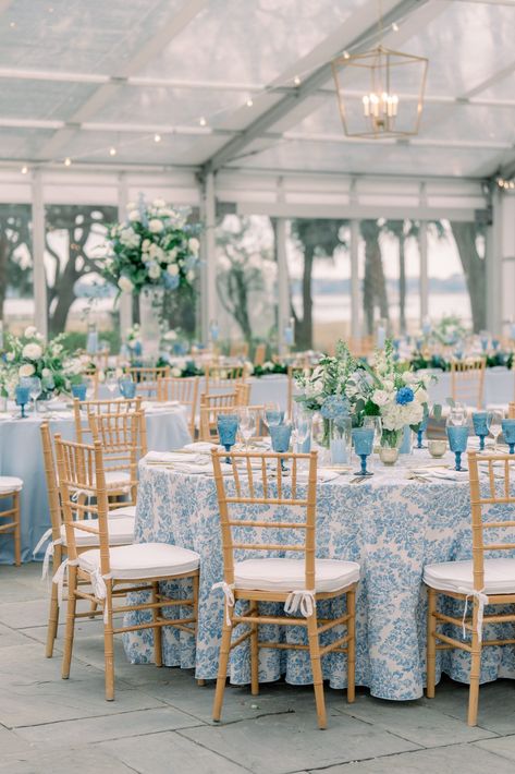 Blue floral table linens with tan chiavari chairs. Blue and white flowers. Blue Tablecloth Wedding Reception, Costal Blue And White Wedding, Blue And White Tablecloth Wedding, Coastal Blue Wedding Decor, Blues And White Wedding, Blue Floral Bridal Party, Blue White Wedding Invitation, Blue And White Toile Wedding, Blue And White Garden Party Wedding