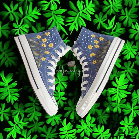 Custom Chucks are your canvas for self-expression. Now you can show off your style in a mix of canvas and denim, topped with summer-inspired embroidered graphics, like butterflies, cactuses, and bright poppies. - High-quality canvas material is thick, durable, and light to help keep the shoe in shape - High-neck design for personality and comfort on the go. - Higher sole in ivory color and glossy finish for easy access. Easy to clean - Ortholite footbed helps you walk smoothly and gently - The logo on the back of the shoe has been renovated in white text on a black background with vintage font - Piercing and side eyelets are made from high-grade rust-resistant metal. With dreamy florals and winding stems, this beautiful pattern will add a whole new dimension to your plain converse. You are Star Converse Shoes, Embroidered Shoes Converse, Converse Noir, Converse Embroidery, Funky Clothing, Embroidery Styles, Chuck Taylor Shoes, Embroidered Converse, Cute Converse