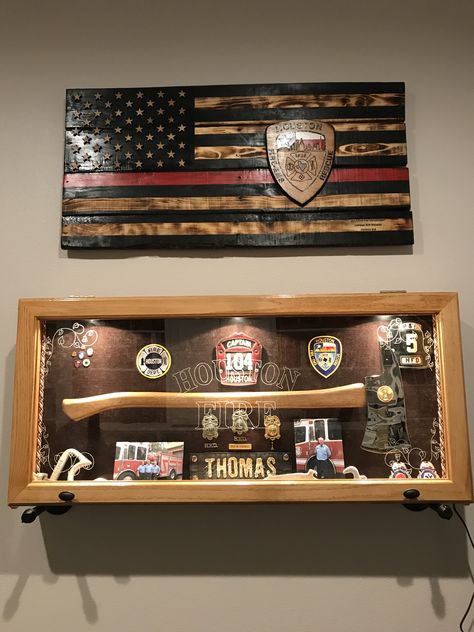 Firefighter shadow boxes and firefighter flag Shadow Box For Firefighter, Firefighter Home Decor Ideas, Firefighter Man Cave Ideas, Firefighter Office Ideas, Firefighter Display Ideas, Firefighter Plaque Ideas, Firehouse Decor Ideas, Firefighter Room Man Caves, Firefighter Bar Ideas