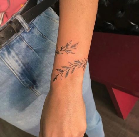 Leaf Wrap Around Tattoo Wrist, Olive Branch Tattoo Arm Wrap Simple, Vine Tattoos Fine Line, Wrap Around The Wrist Tattoos, Wrist Tattoo Wrap Around, Simple Olive Branch Tattoo, Minalistic Tattoos, Olive Branch Wrap Around Tattoo, Rap Around Tattoo Arm