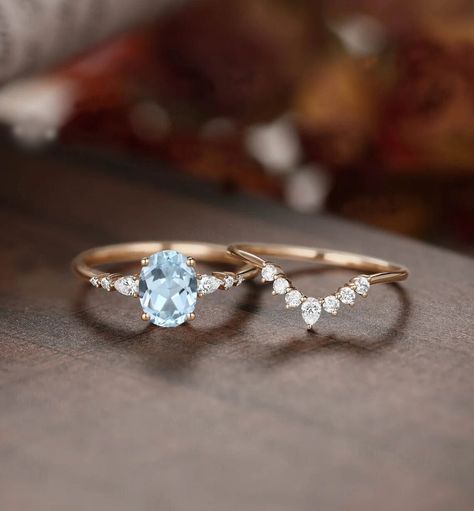 "1.8ct vintage aquamarine engagement ring set rose gold ring set women custom jewelry March birthstone ring moissanite ring set We are Manufacturer and Exporter of all type of Silver and Gold Jewelry---------- ** We Offer CUSTOM MADE SERVICES and WHOLESALE DISCOUNTS on LARGE QUANTITY PURCHASE. 》DIMENSIONS《 ❥ All Pieces Have 925 Stamp/14k/18k ❥ Main Gemstone :- Aquamarine ❥ Shape :-Oval ❥ Size :- 7X9 MM ❥ Material :- Sterling Silver/14k/18k White/Yellow/Rose Gold) ❥ Purity :- 925/14k/18k  ❥ Finis Promise Ring Engagement Ring Set, Wedding Ring With Aquamarine, Rose Gold Aquamarine Ring, Vintage Aquamarine Ring, Aquamarine Birthstone Ring, Aquamarine Wedding Ring, Aquamarine Ring Vintage, Rose Gold Ring Set, Aquamarine Birthstone