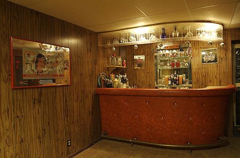 Yes, the bar is orange vinyl, the walls are wood paneling, and the carpet is shag. All are authentic.  I can only imagine the parties that have occurred in the thirty-five or so years since this basement was "finished". Well, I remember those that have occurred since I bought the house eight years ago, but I think you know what I mean... Vintage Basement Bar Ideas, Retro Basement Bar, Bar Panelling, Vintage Basement Bar, Basement Bar Designs Small, Retro Basement Ideas, 70s Basement, 70s Bar, Vintage Basement