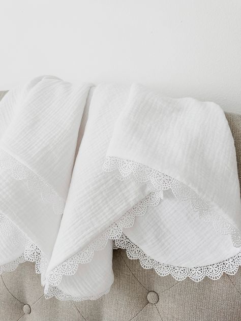 "White  Lace Swaddle Blanket is perfect breathable blanket for your little one. Great for car seat  Blanket, and  perfect baby shower gift. Blanket is handmade with white   double gauze  on both sides and white lace trim.   EMBROIDERY INFO: Please include the following at checkout in the  \"Notes to Seller Box\": 1. Name that you want on blanket 2. Thread color 3. Font # or letter style  4. Name to be in corner or middle down blanket (shown in pictures)  🌿 second photo shows how it will get bubbly fabric after drying in dryer and flat if you air dry  🌿Each blanket measures approximately 32\"x36\" 🌿 If you need custom size, please feel free to contact me.  🌿All items made by hand in smoke and pet free home.  🌿 Recommended care: For best results Machine or Hand Wash, Cold; Line Dry or i Muslim Baby Blankets, Hand Embroidered Baby Blanket, Newborn Style, Trim Embroidery, Tv Ideas, Vintage Baby Blanket, Down Blanket, Embroidered Baby Blankets, Newborn Fashion