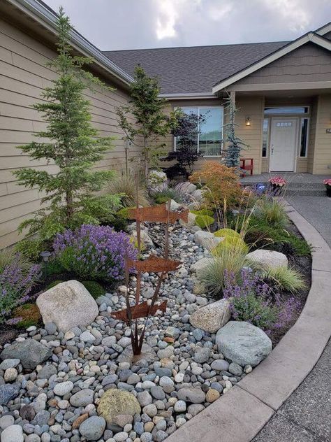 Xeriscape Side Of House, Boulders In Garden Design, Rock And Grasses Landscaping, Landscape Fountain Ideas Front Yards, Front Entrance Walkway Landscaping, Dry River Bed Front Yard, Simple Rock Garden Landscaping, Breezeway Landscaping Ideas, Front Hill Landscaping Ideas