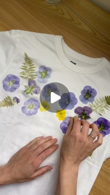 Custom WearHouse on Instagram: "Flower-printed tee 🌸💐 by @hammerflower  . This botanical printing method is achieved by hammering flowers into the fabric! ✨️ What do you think of this technique? . . . . #botanicalart #botanicalprint #flowerpressing #flowerprint #floralprint #floralfashion #floralart #naturaldye #customtees #handprintedtextiles #textileart #tshirtprinting" Hammered Flowers On Fabric Diy, Hammer Print Flowers, Flower Hammering On Fabric, Flower Printing With Hammer, Hammer Flowers On Fabric, Pounded Flowers On Fabric, Botanical Printing On Fabric, Pounded Flower Art, Flower Hammering Fabric
