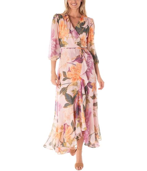 From Maison Tara, this dress features:Chiffon fabricationFaux wrap dress silhouetteV-neckline3/4 sleevesSelf-tie belt at waistFloral printRuffle detailingLinedCenter back zipper closureApprox. 59" lengthPolyesterHand washImported. Outdoor Wedding Guest Dresses, Casual Wedding Guest Dresses, Mother Of Groom Dresses, Wrap Maxi Dress, Mob Dresses, Daytime Dresses, Maxi Styles, Full Length Dress, Modieuze Outfits