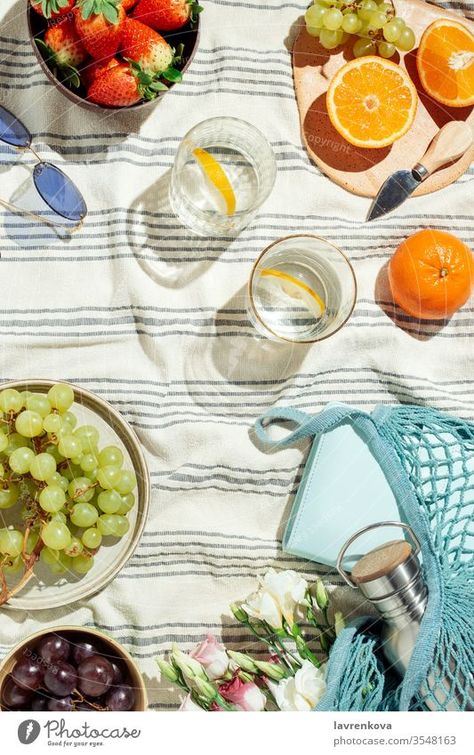 Summer picnic flatlay, fruits, berries and lemon water on striped cotton blanket - a Royalty Free Stock Photo from Photocase Summer Food Styling, Summer Picnic Photography, Picnic Product Photoshoot, Italian Summer Decor, Picnic Product Photography, Picnic Flatlay, Goop Kitchen, Summer Still Life, Summer Flatlay