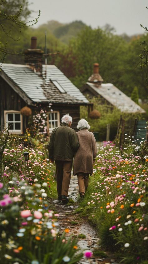 Elderly Couple Walking: An elderly couple takes a leisurely walk together along a flower-lined path near rustic cottages. #elderly #couple #walking #flowers #path #cottages #tranquility #village #aiart #aiphoto #stockcake https://ayr.app/l/pfoq Elderly People Aesthetic, Old Couple Traveling, Couple Gardening Together, Man And Woman Walking Together, Elderly Aesthetic, Man Protecting Woman, Helping People Aesthetic, Village Life Aesthetic, Old Woman Aesthetic