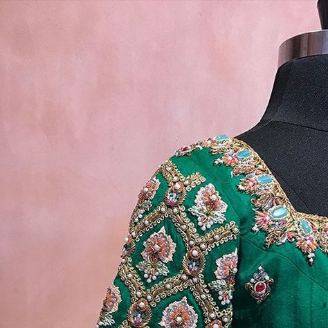 BlouseHousebyMahithaPrasad on Instagram: "Get ready for your queen-like regal look with Heavy Doses of Handcraft in this magnificent, made-to-order Dark Green Raw Silk Blouse from Blouse House by Mahitha Prasad. This royal piece dazzles with jewelled Buttas scattered all across its body, enhanced by distinctive sleeve embroidery. The intricate Jewelled Embroidery on the Neckline and Sleeve ends is done using a triad of Colorful Beads, Pretty Pearls and Sequins. Completing the look with the Bac Body Blouse, 2024 Dress, Raw Silk Blouse, House Of Blouse, Bridal Blouses, Wedding Saree Blouse, Wedding Saree Blouse Designs, Sleeve Embroidery, Blouse Embroidery