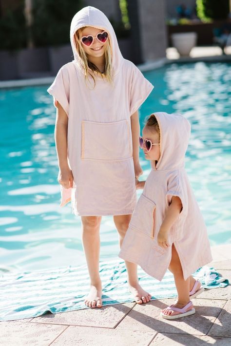 "Our Kindhood poncho towels were designed to keep kids moving.  Made from a unique cotton/bamboo blend, our ponchos are engineered to be ultra-soft and comfortable, yet flexible and quick-drying.  Whether your kids are building sand castles, collecting shells, running around, or just sitting and eating--our ponchos will keep them warm and protected. Each Kindhood poncho is made from 70% sustainable bamboo fiber and 30% cotton blend. Ponchos feature an ultra-soft, absorbent, and quick-drying terrycloth interior; a hood for warmth and protection; and a pouch pocket for your littles to keep their hands warm, snacks safe, and seashell collections secure. Each Kindhood poncho is made from 70% sustainable bamboo fiber and 30% cotton blend. Ponchos feature an ultra-soft, absorbent, and quick-dryi Ponchos, Warm Snacks, Orange Monochrome, Collecting Shells, Towel Poncho, Building Sand, Kids Clothes Diy, Sand Castles, Kids Poncho