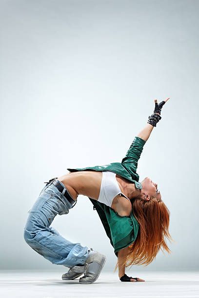 Break Dance Girl Stock Photos, Pictures & Royalty-Free Images - iStock Croquis, Street Dance Photography, Modern Dance Poses, Modern Dance Photography, Dancing Pose, Dancing Poses, Dance Background, Dancer Lifestyle, Dance Picture Poses