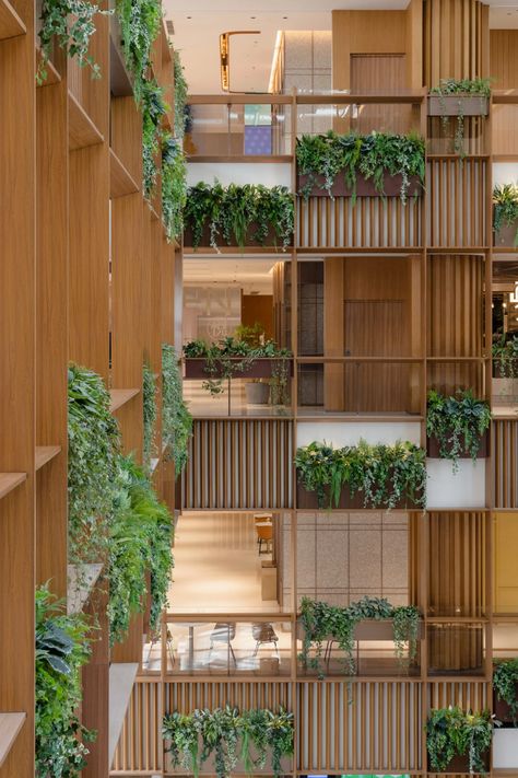 AIM Architecture turns Xintiandi shopping mall atrium into plant-filled plaza Aim Architecture, Atrium Garden, Atrium Design, Natural Fiber Carpets, Outdoor Paving, Parks Furniture, Wooden Facade, Wooden Trellis, Green Facade