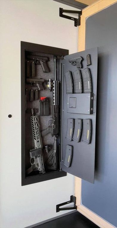 Secret Storage | TheHiddenHinge | Maple Grove Secret Doors In Houses, Hidden Wall Safe, Door Remodel, Secret Rooms In Houses, Concealment Furniture, Tactical Wall, Gear Room, Door Aesthetic, Hidden Safe