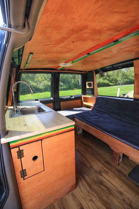 Could you live in an ultra-small space? Check out this rasta-themed Astro Van conversion by Freedom Vans! #van #vanlife #smallspace #tinyhouse #tinyhome #tinyliving #astrovan #chevyastro #kitchen #kitchenette #freedomvans #vanconversion #convertedvan #convertedastro Gmc Safari Van Conversion, Astro Van Conversion Interiors, Astrovan Conversions, Gmc Safari Camper Conversion, Chevy Astro Van Conversion, Astro Camper Van, Astro Van Camper, Astro Van Conversion, Van Life Interior