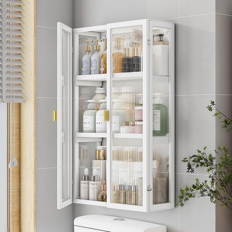 PRICES MAY VARY. 💖Wall Storage Cabinet - Having this storage cabinet mounted on the wall can maximize the use of space and save valuable floor space. You can install it at a suitable height for quick access to your items. 💖Storage Cabinet - This wall cabinet is designed with three tier shelves, which provides you with a flexible storage solution to classify and store different items. More items could also be displayed on the top of it. 💖Sturdy Material - Made of heavy-duty steel, clear acryli Behind Door Bathroom Storage, Bathroom Built In Storage Cabinet, Bathroom Over The Toilet Ideas, Bathroom Wall Cabinet Ideas, Small Bathroom Hacks, Storage For Small Bathroom, Over The Toilet Storage Ideas, Storage Ideas For Small Bathrooms, Bathroom Cabinet Ideas