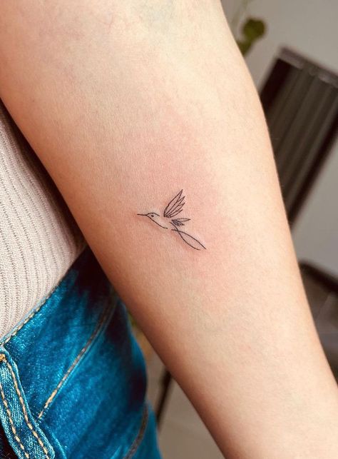 100 Beautiful Hummingbird Tattoos And Meaning - The Trend Scout Minimalist Hummingbird Tattoo, Minimalist Hummingbird, Humingbird Tattoo, Hummingbird Tattoo Design, Hummingbird Tattoo Meaning, Mockingbird Tattoo, Hummingbird Flower Tattoos, Hummingbird Tattoos, Small Hummingbird Tattoo