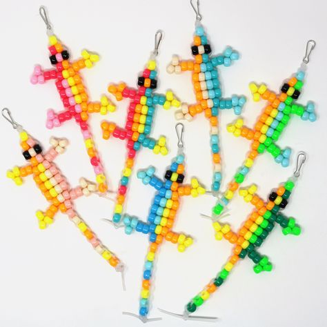 "Remember when," can be today, with the sweet nostalgia of a 90s-style beaded lizard keychain. Features a lanyard clip to easily add to keys or bags. Check out the other color options listed in the shop. * * * * * * * * * * BeadZoo was founded by two young entrepreneur sisters, for a local fair. Their dream didn't end with the fair, so we've helped them move it online. Each beaded creation is handmade by them, and quality checked by parents. Every penny earned makes them do a happy dance, as it goes straight to their piggy banks. * * * * * * * * * * Safety: Small parts present choking hazard. Supervise older children, and keep away from little ones. Buyer or recipient assumes all risk and is responsible for the use and care of this product. Beaded Lizard Keychain, Lizard Keychain, Beaded Lizard, Bead Lizard, Y2k Nostalgia, Accessories Colorful, Animal Accessories, Young Entrepreneur, Piggy Banks