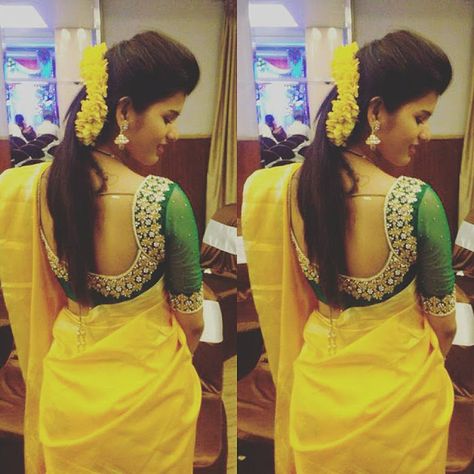 Bright yellow silk saree with plain border, dark green maggam and kundan work floral blouse with very broad neck patterned. Small beads an... Tamil Clothes, Elegant Sarees, Neck Patterns, Indian Celebrity, Latest Blouse, Wedding Blouse Designs, Sari Blouse Designs, Yellow Saree, Maggam Work Blouse Designs