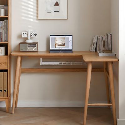 Maximize your workspace with our all-wood corner desk. Efficiently utilizing your home's 90° corners, it offers expanded desktop space. Featuring an L-shaped design with a built-in cable hole and under-desk metal cable organizer, it keeps your workspace tidy. Sturdy, with wide-set legs and reinforcing crossbars, it's both stable and durable. Rounded edges ensure safety and comfort. Elevate your work experience with this sleek and functional desk. | Orren Ellis 62.99"L-shaped wood solid wood desk Retro Corner Desk, Corner Desk For Bedroom, Mcm Office Desk, Corner Desk Wood, Rounded Corner Desk, Desk In Corner Of Bedroom, Corner Work Desk, Corner Desk Small Space, Desk Corner Ideas