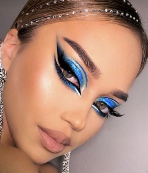 Gorgeous blue glitter eyeshadow look with killer smoked out liner with beautiful lashes. #makeupIdeas #makeuplooks #makeupinspiration #makeup Ballroom Makeup Blue, Blue Dance Makeup, Rave Makeup Blue, Freestyle Disco Dance Makeup, Blue Stage Makeup, Dramatic Blue Eye Makeup, Makeup For Dance Performance, Blue And White Eyeshadow Looks, Show Makeup Dancers